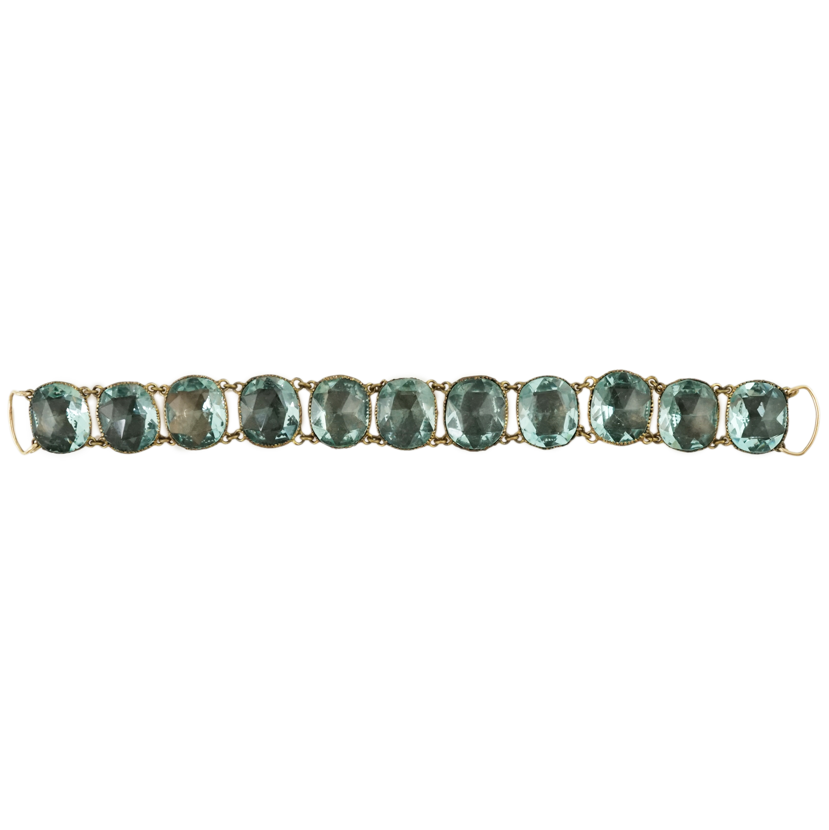 A rare 18th century 'Queen Anne' gilt metal and foil backed aquamarine paste bracelet